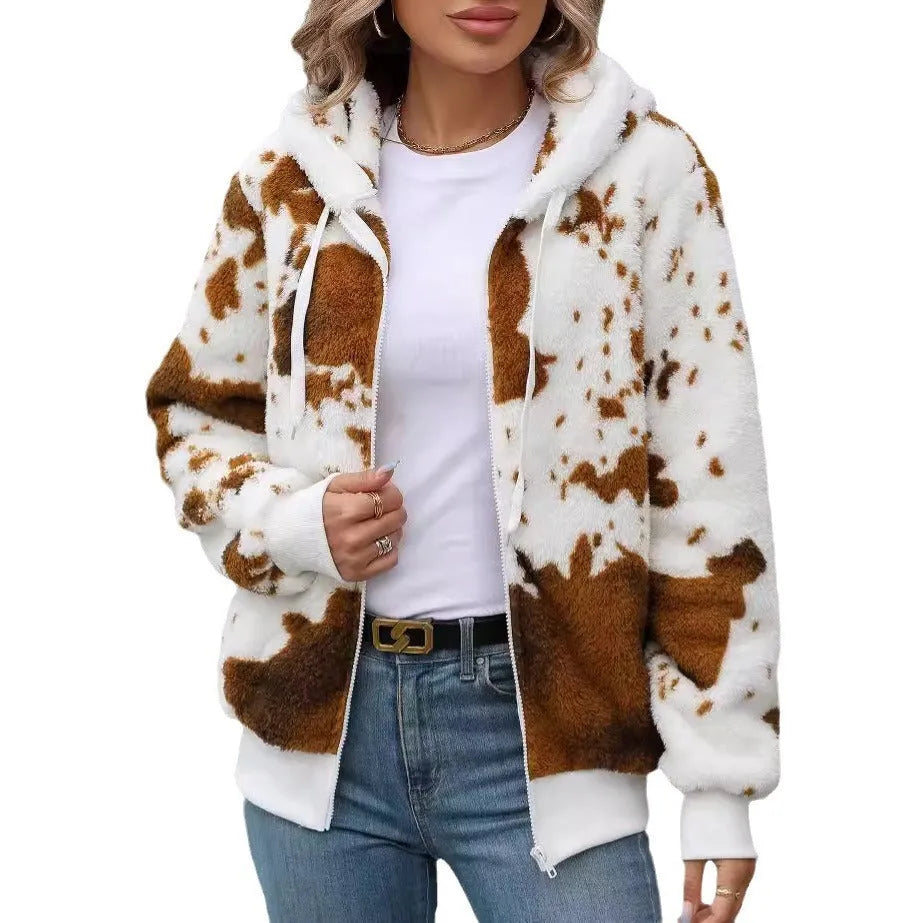Yellow and brown cow print hooded cardigan jacket with a full front zip on a model.