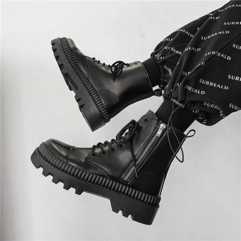 Men's black platform ankle boots with 8-eye lacing and a side zipper on a rubber sole.