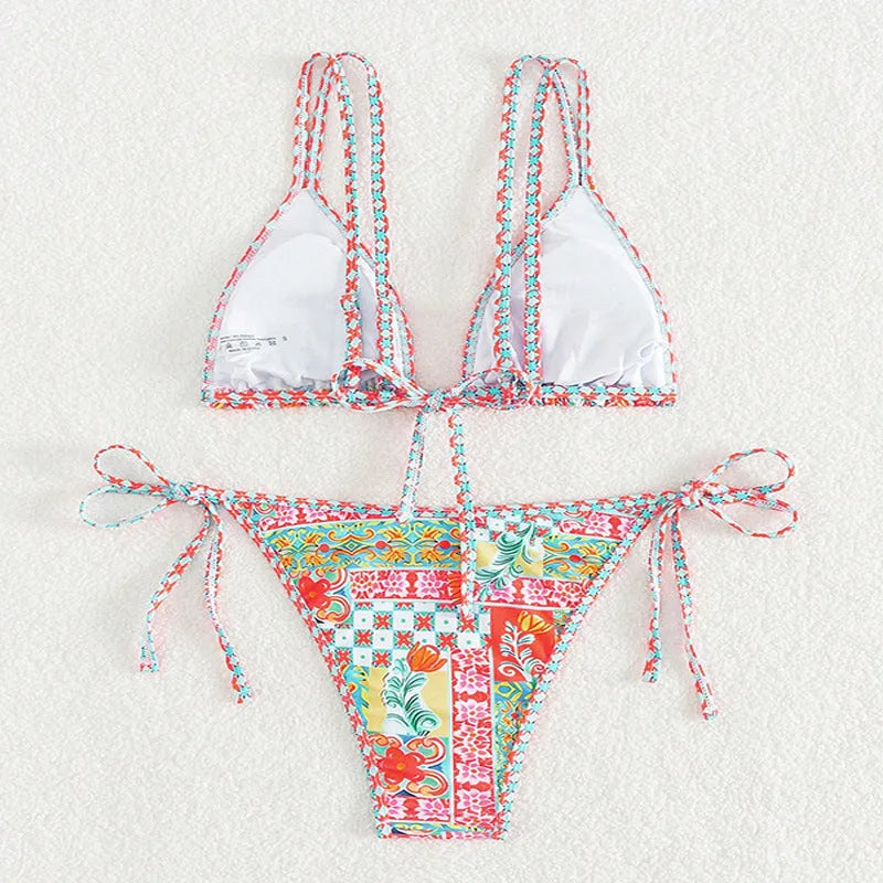 Women's lace-up split swimsuit in picture colour with a backless design and high-cut brief.