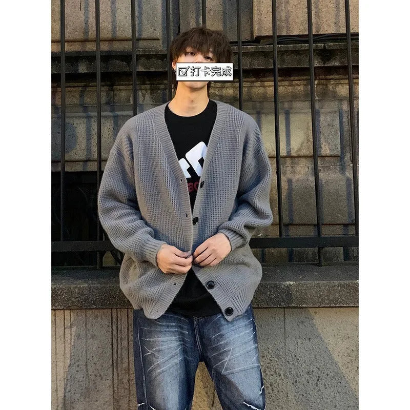 Men's loose fit casual cardigan sweater in army green, shown on a hanger.