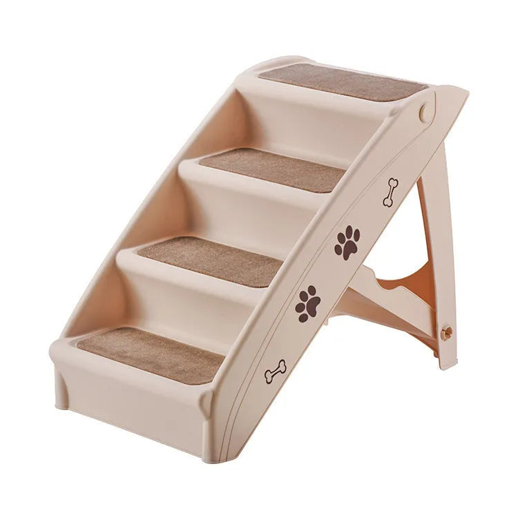 Foldable plastic pet step ladder in beige colour with non-slip mat, placed next to a sofa.