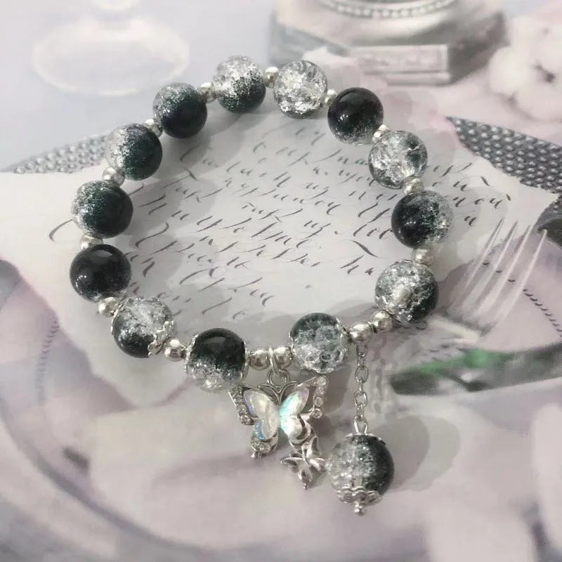 Handmade Chinese style glass bracelet with bamboo joint beads in a red Lvzhu Duobao design.