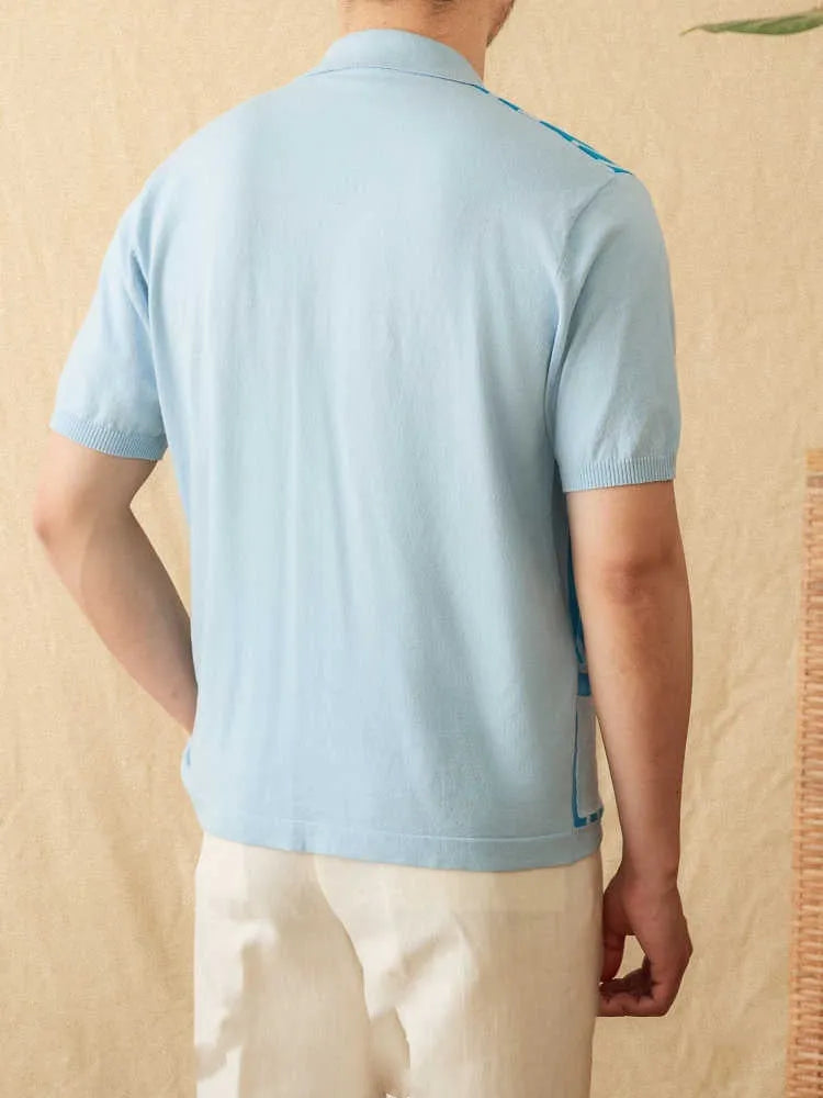 Royal blue striped short-sleeved knitted cardigan polo shirt with a lapel collar laid flat.