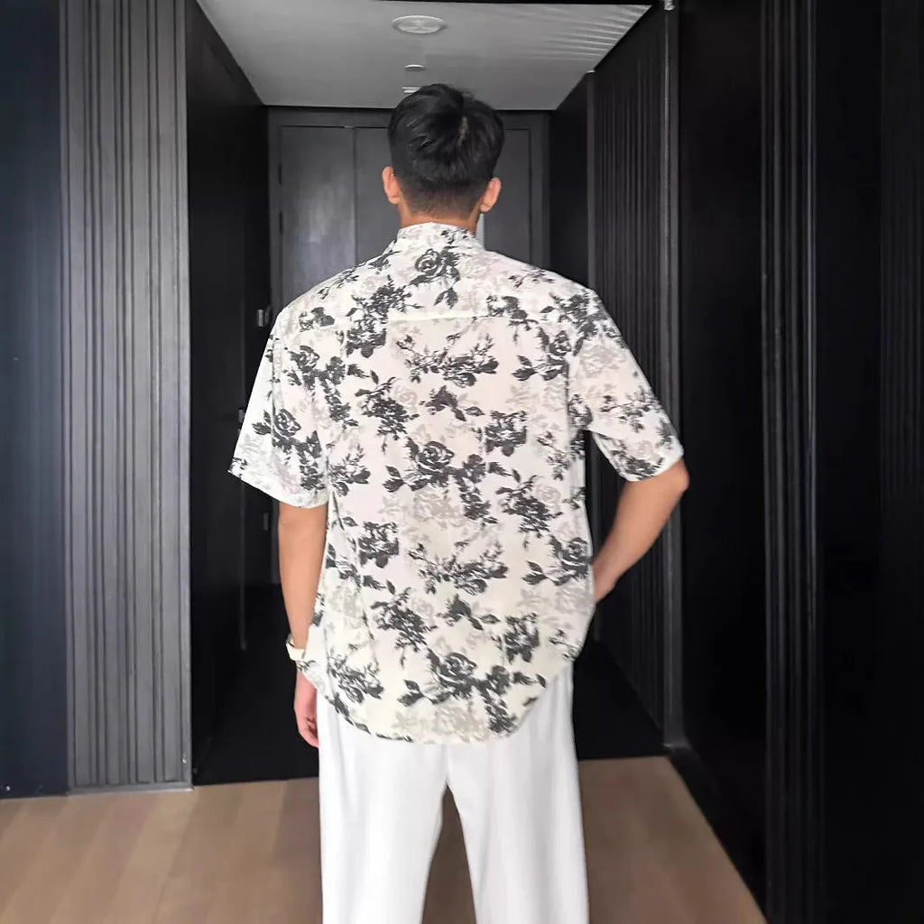 Floral printed short sleeve shirt in loose casual pendant style shown in white and black options