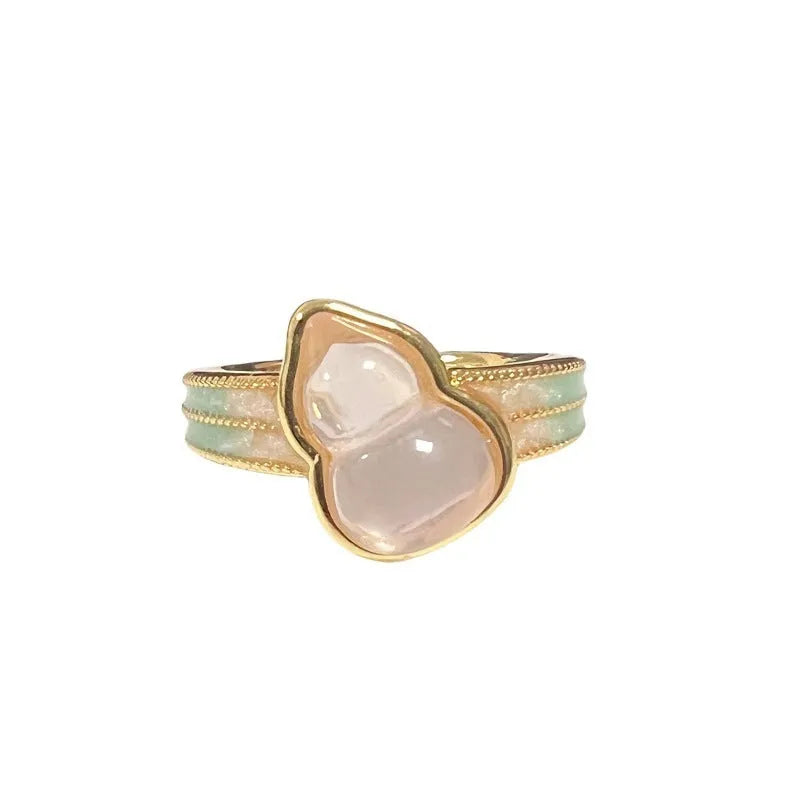 Adjustable copper vintage gourd ring with inlaid zircon stones showing floral and bow design elements