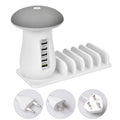 Mushroom-shaped white USB charging dock with 5 ports and integrated LED night lamp on desk
