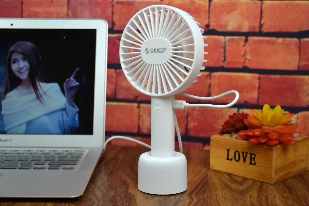 White portable USB desk fan with rechargeable battery, showing three-speed controls and compact design