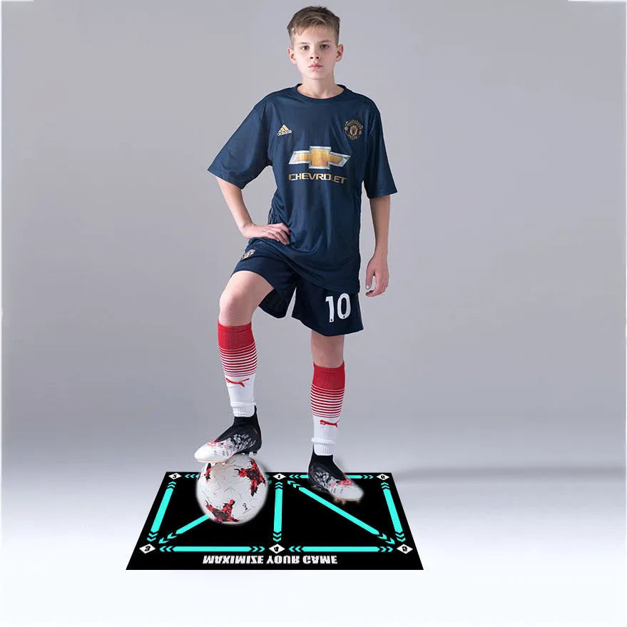 Black rectangular 60x90cm football training mat with a non-slip rubber base.