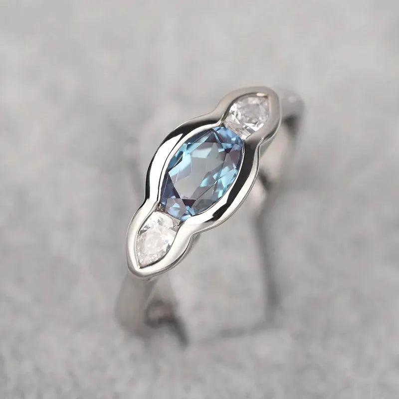 Women's geometric ellipse copper ring with white gold plating and zircon stones in UK sizes 6 to 10