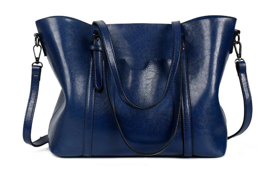 Retro messenger bag for women in multiple colours showing large main compartment and shoulder strap