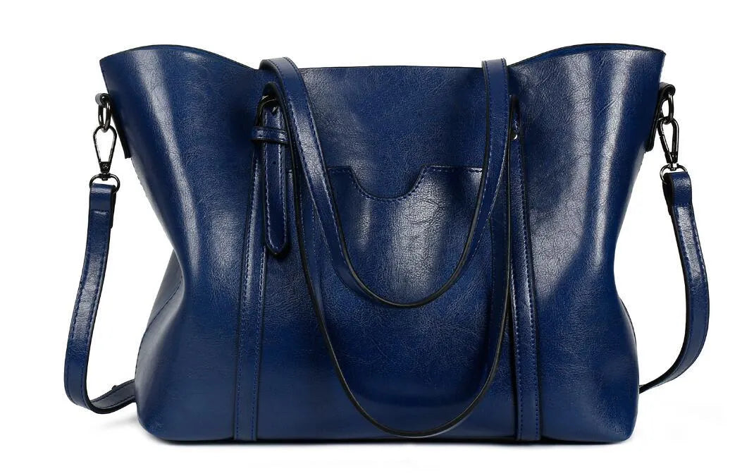 Retro messenger bag for women in multiple colours showing large main compartment and shoulder strap