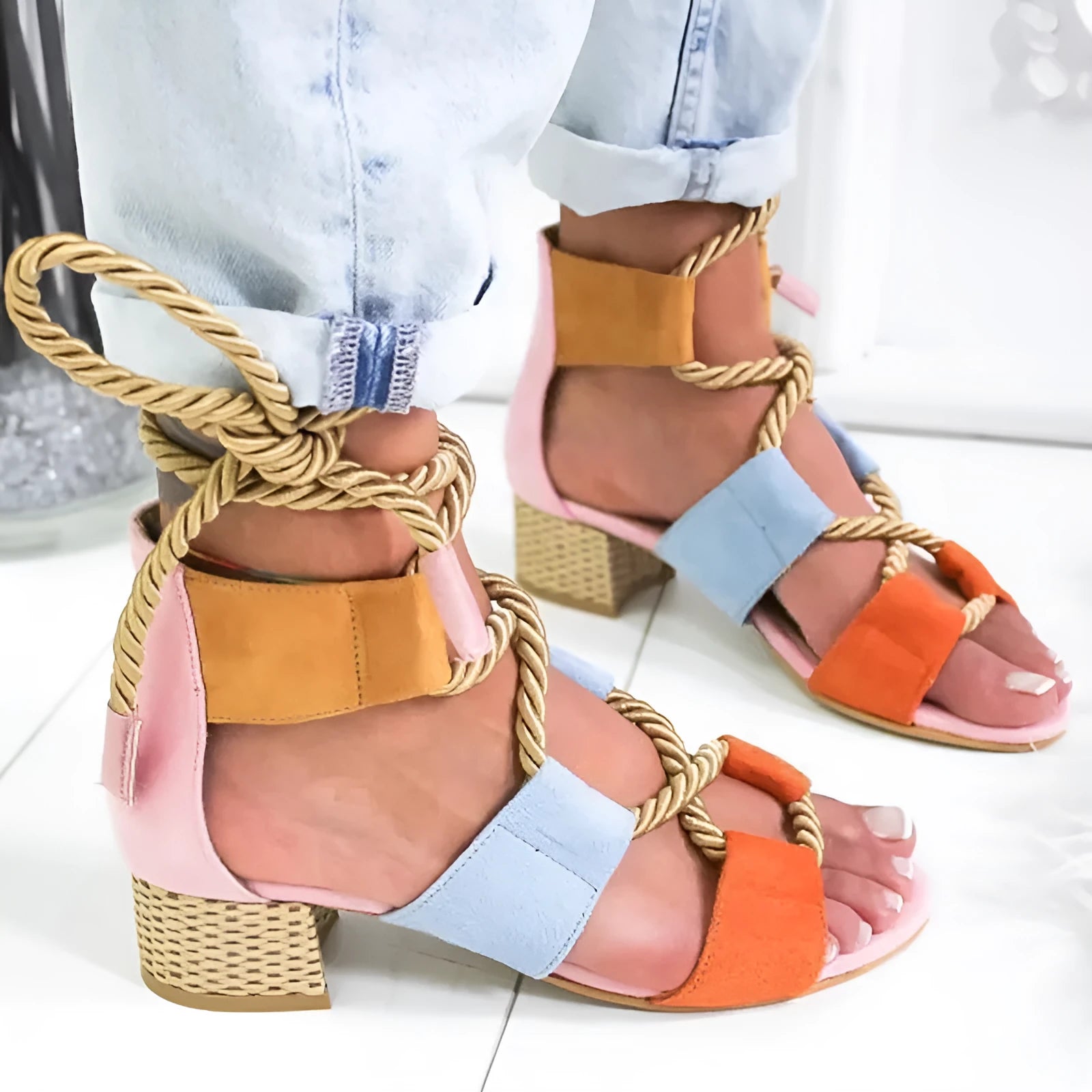 Women's beige suede sandals with a chunky heel, colour-block panels, and an ankle strap.