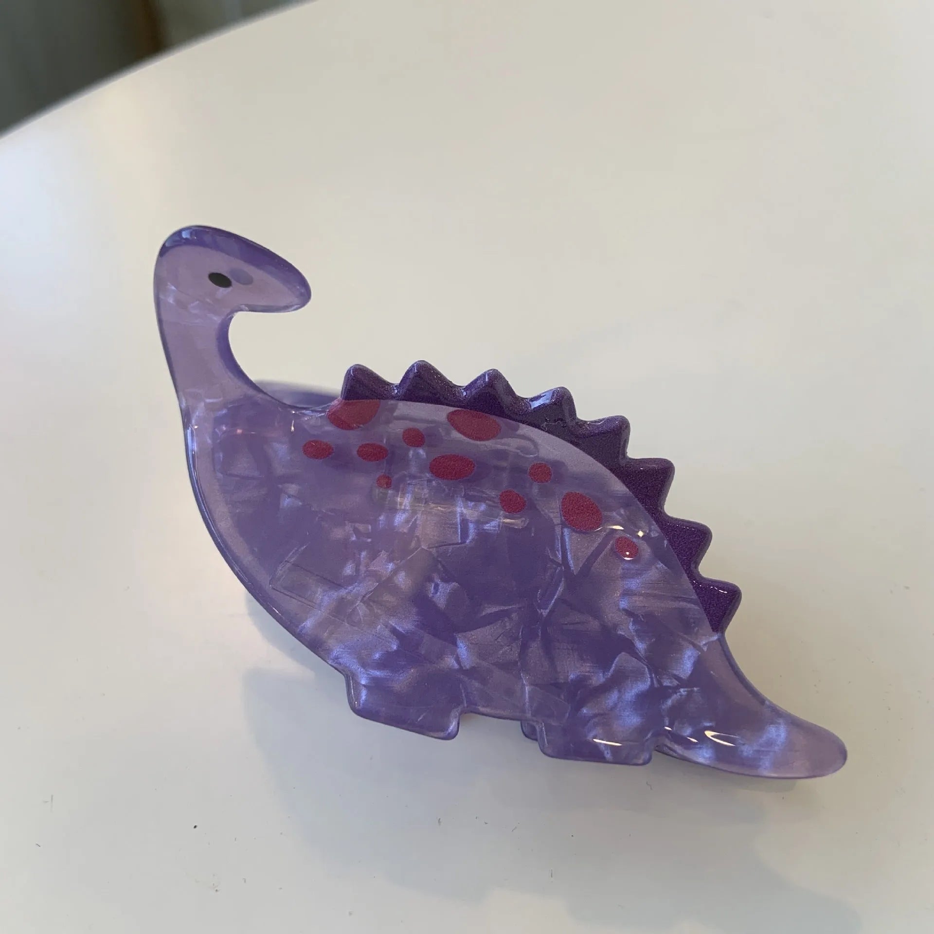 Acrylic dinosaur jaw hair clip in pink pterosaur colour with grip fastening mechanism