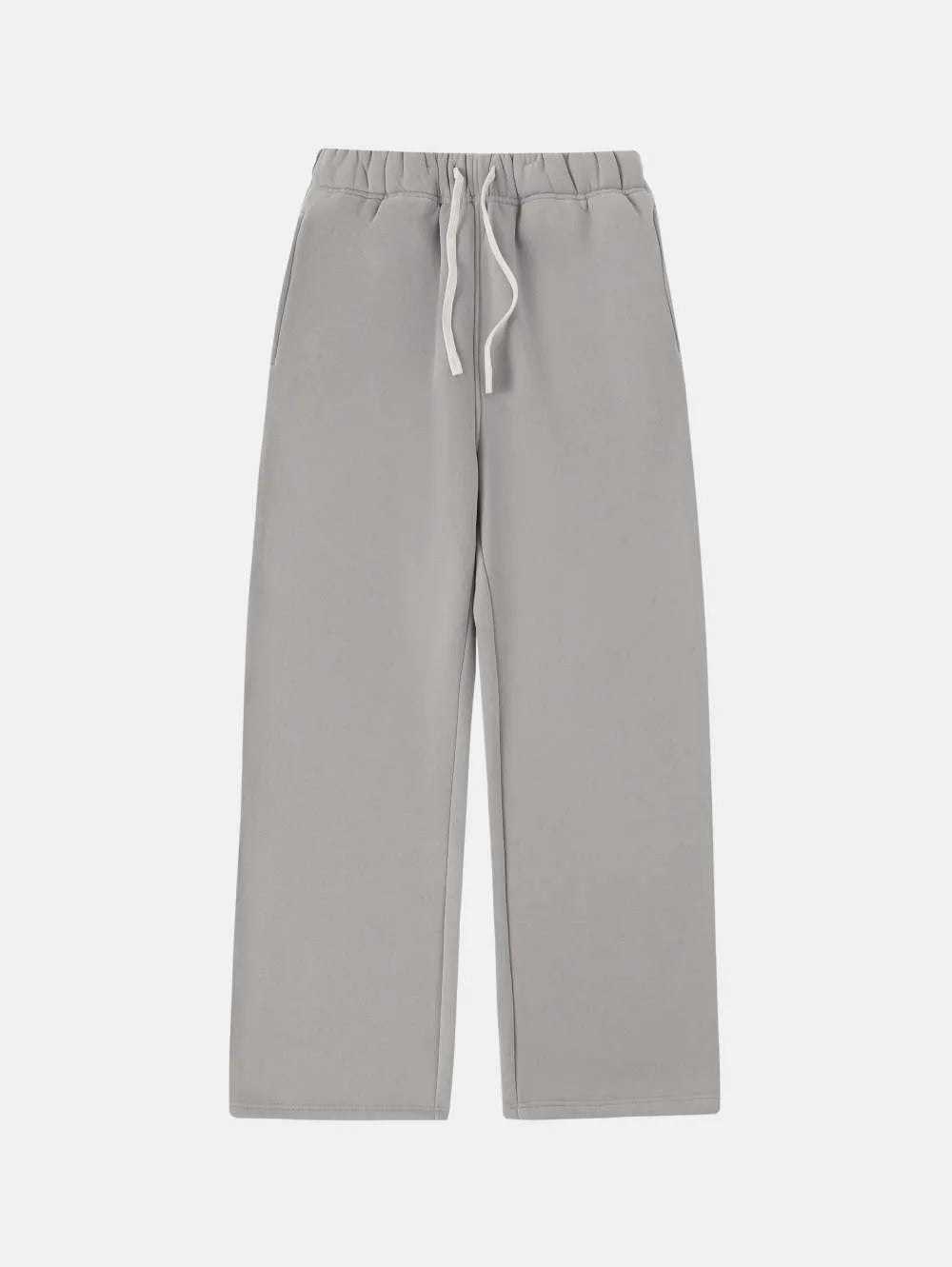 Man wearing black fleece-lined loose-fit sweatpants with an elastic drawstring waist