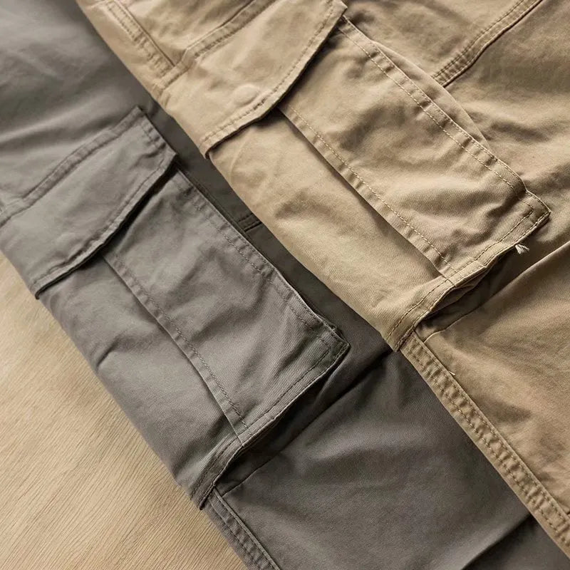 Men's solid colour cotton labour protection trousers with multiple pockets, shown in khaki.