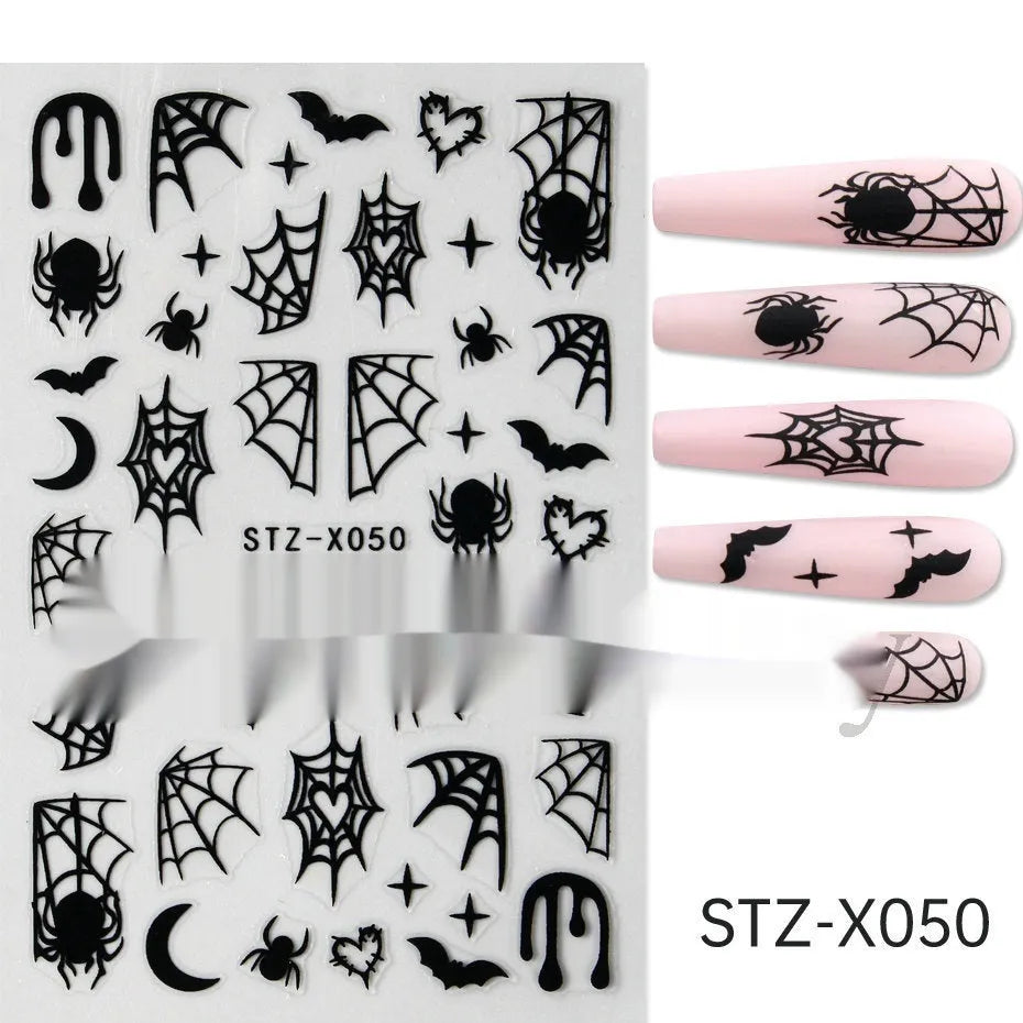 Close-up of a cartoon-style nail sticker with black and silver strips and a love pattern design on a fingernail.