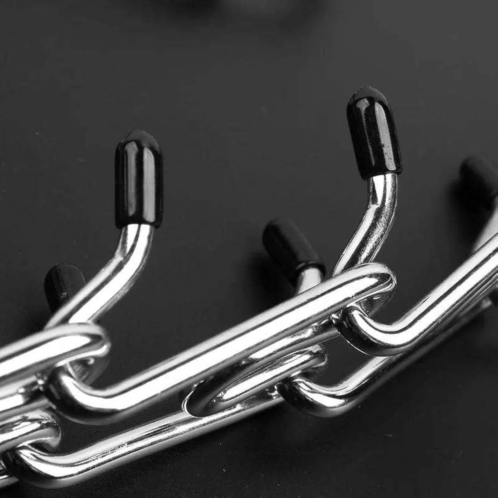 Stainless steel dog prong training collar with adjustable links and rubber comfort tips.