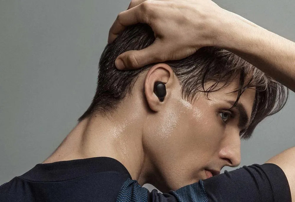 Redmi AirDots 2 Black true wireless earphones with their compact charging case.