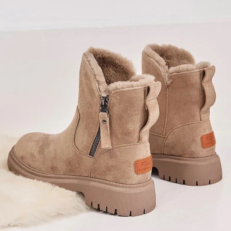Women's black high-top snow boots with side zipper and thick plush lining on a winter background.
