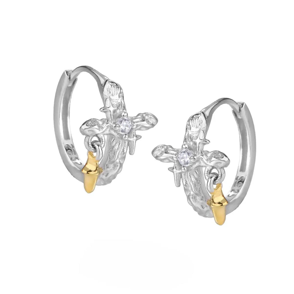 XINGX geometric cross earrings in 925 silver with white gold electroplated finish and circular detail.