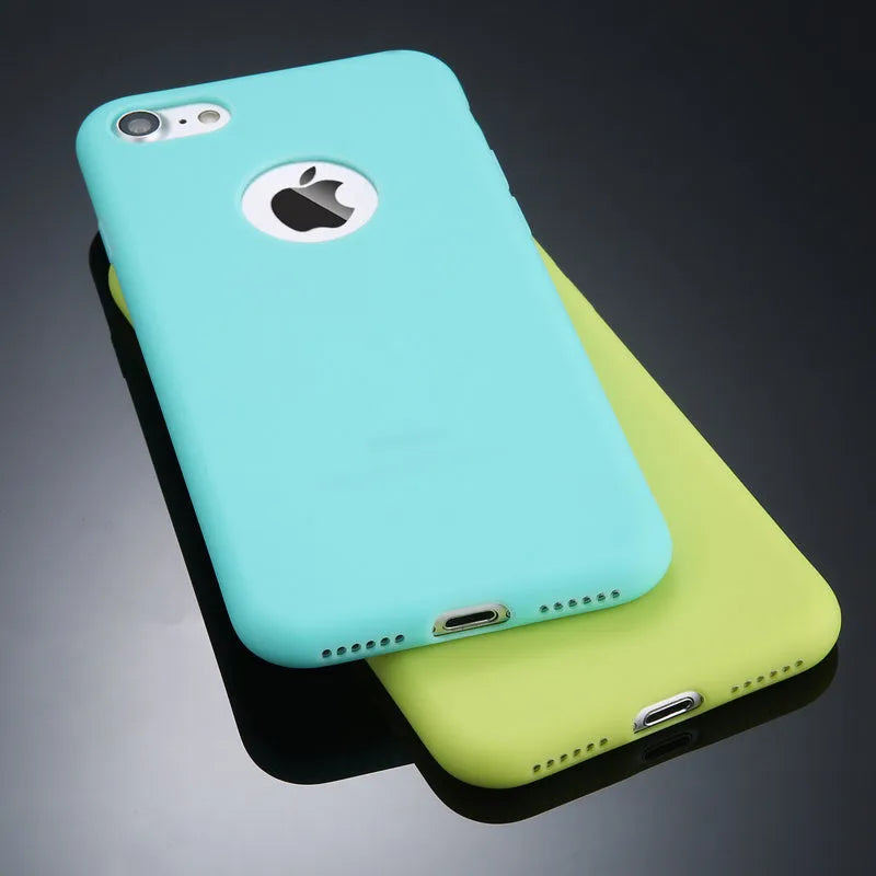 Soft silicone TPU phone case for iPhone in candy colours including pink, blue, and black on a plain background.