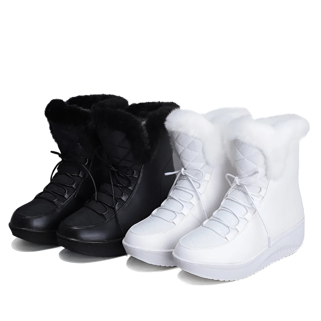 Black women's lace-up winter boots with a platform sole on a white background.