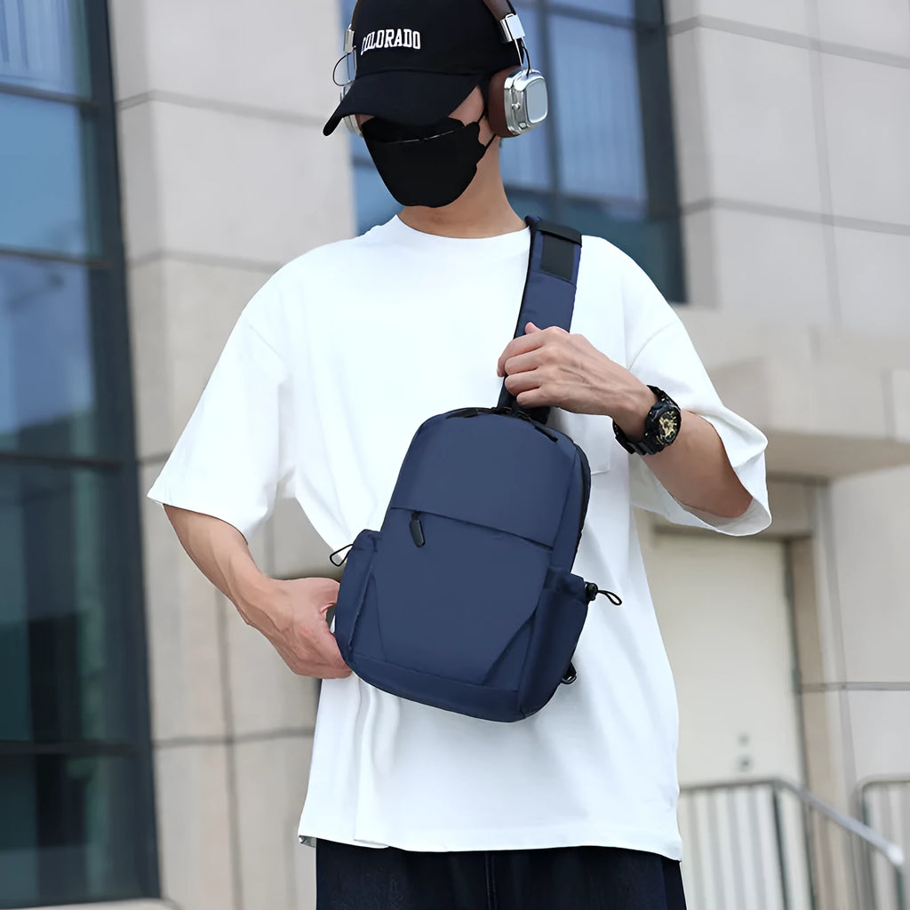 Men's grey waterproof chest bag with shoulder strap showing 33cm height dimensions