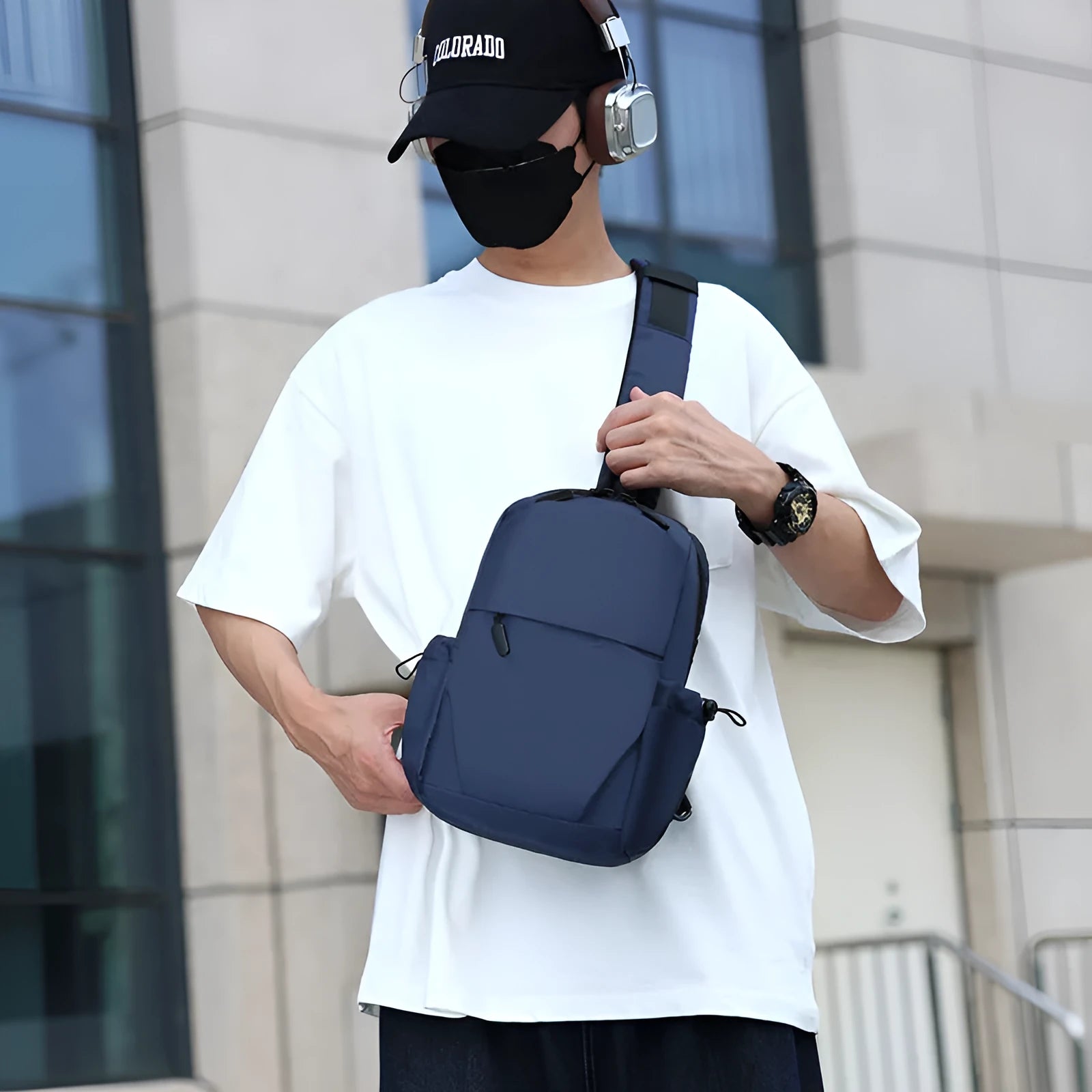 Men's grey waterproof chest bag with shoulder strap showing 33cm height dimensions