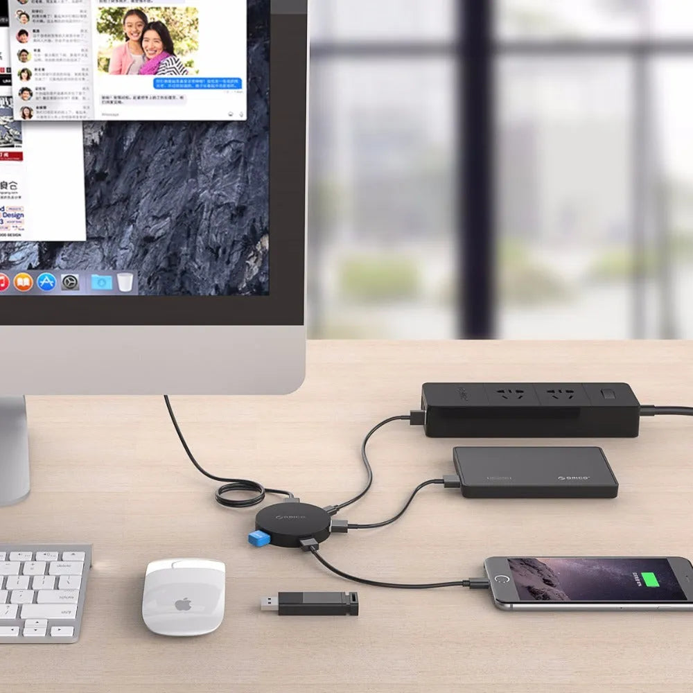 ORICO HA4U-U3 USB 3.0 hub with four ports, compact black plastic casing, 60x60x12mm