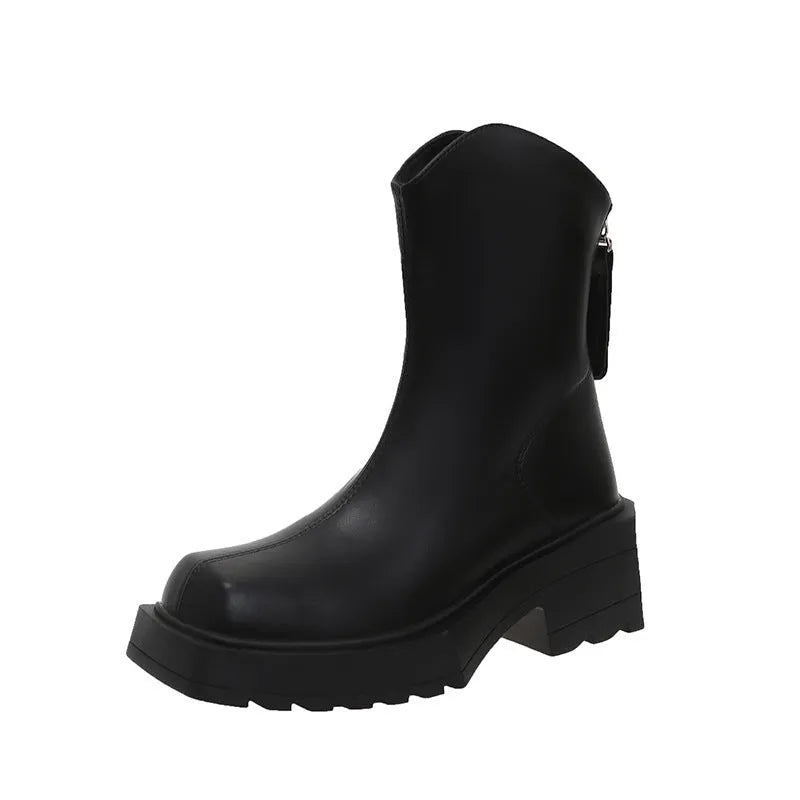 Women's black platform Martin ankle boots with a square toe, chunky sole, and back zipper.