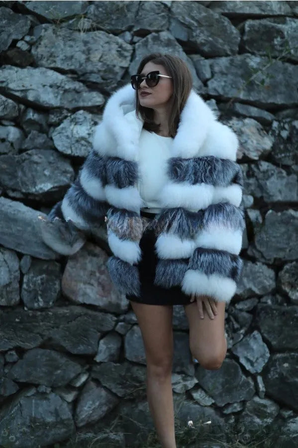 Women's loose artificial fur coat with hood in brown colour on mannequin