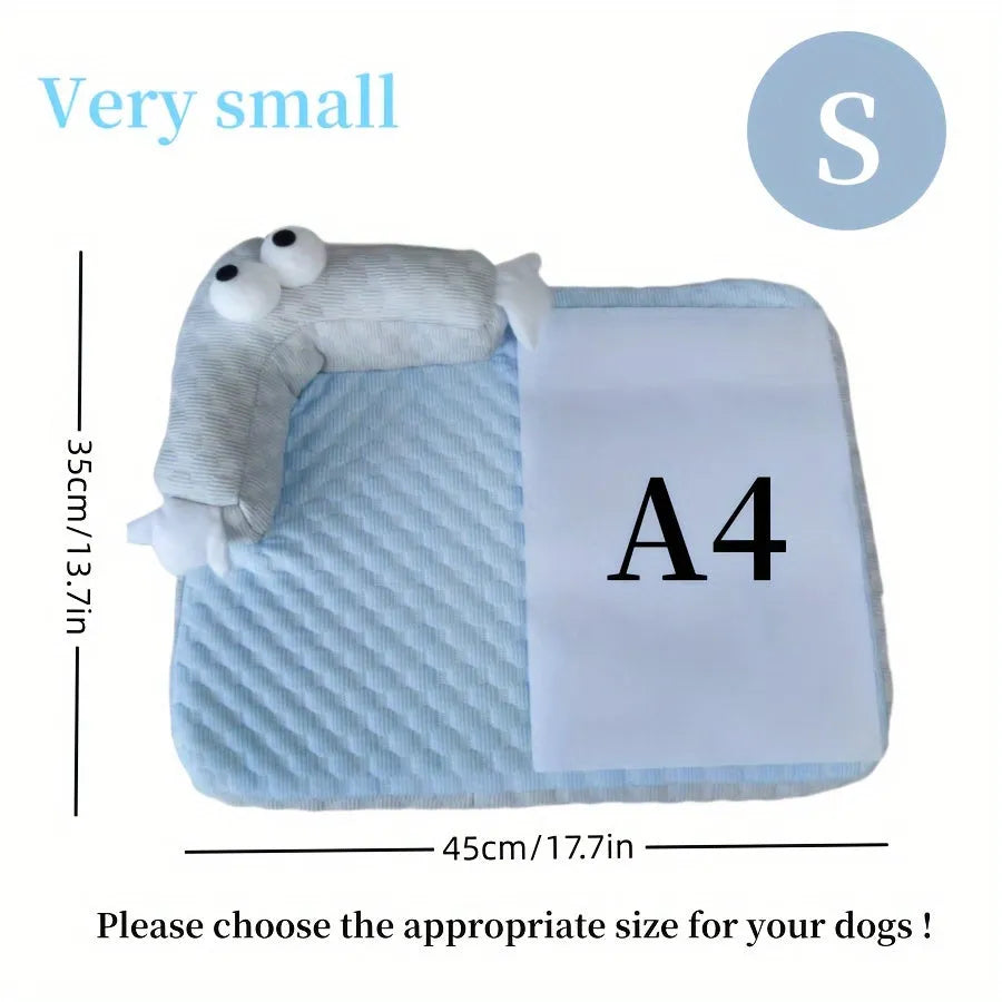 Blue pet cooling mat with big-eyed monster design on a wooden floor, shown in large (L) size.