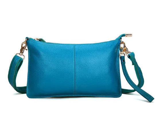 Structured cowhide leather lady slant bag showing front zipper compartment and dual strap options