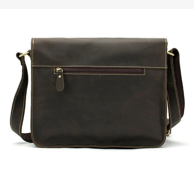 A leather vintage messenger crossbody bag shown in dark coffee colour with a flap closure and adjustable strap.