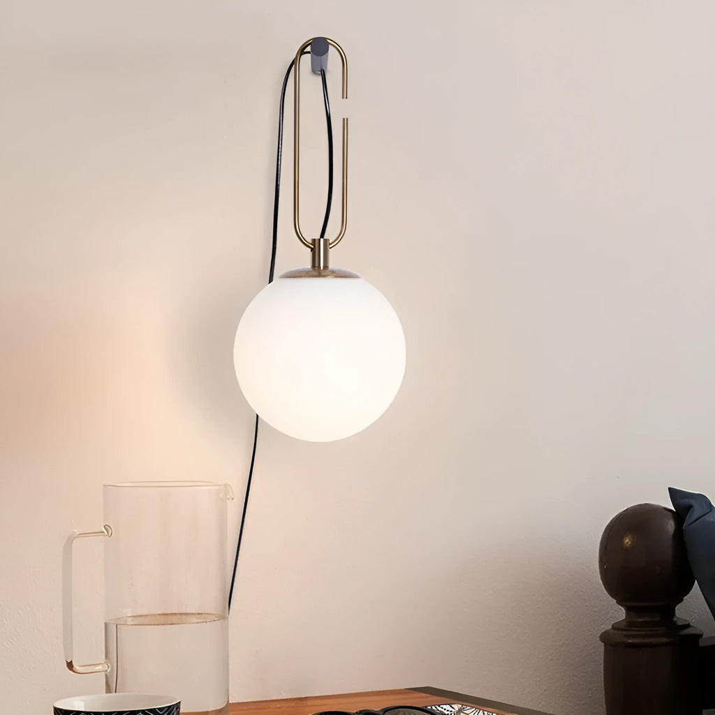 Nordic modern glass wall lamp mounted on a wall, showcasing its translucent design.