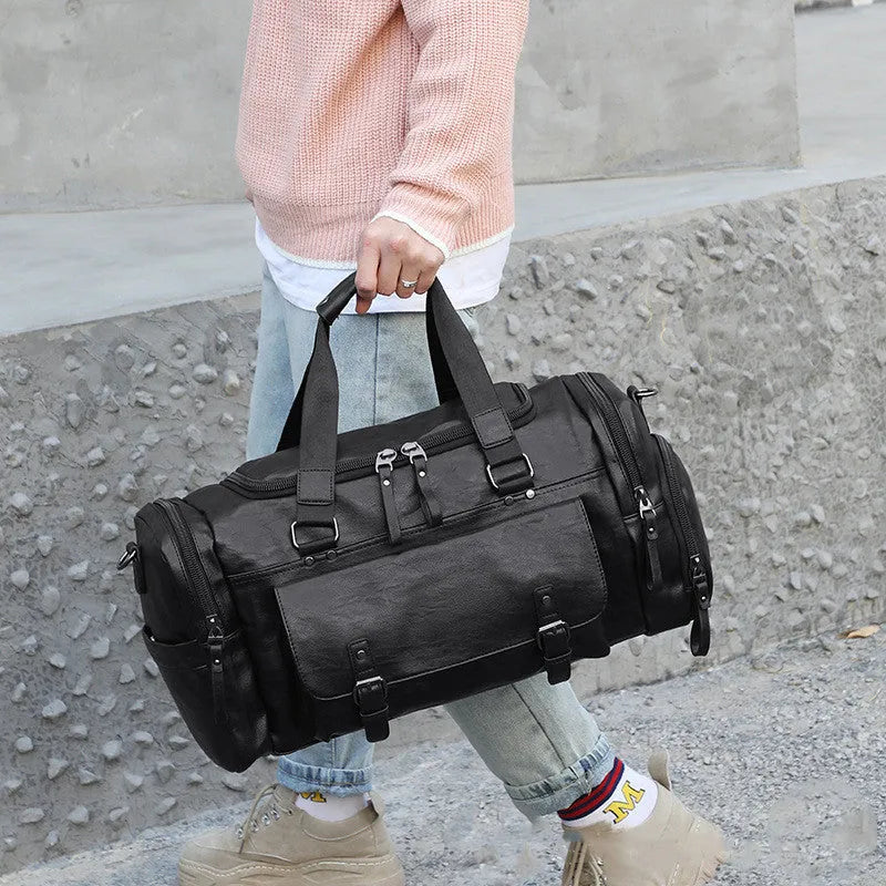 Black wheeled duffle travel bag with telescopic handle and separate shoe compartment