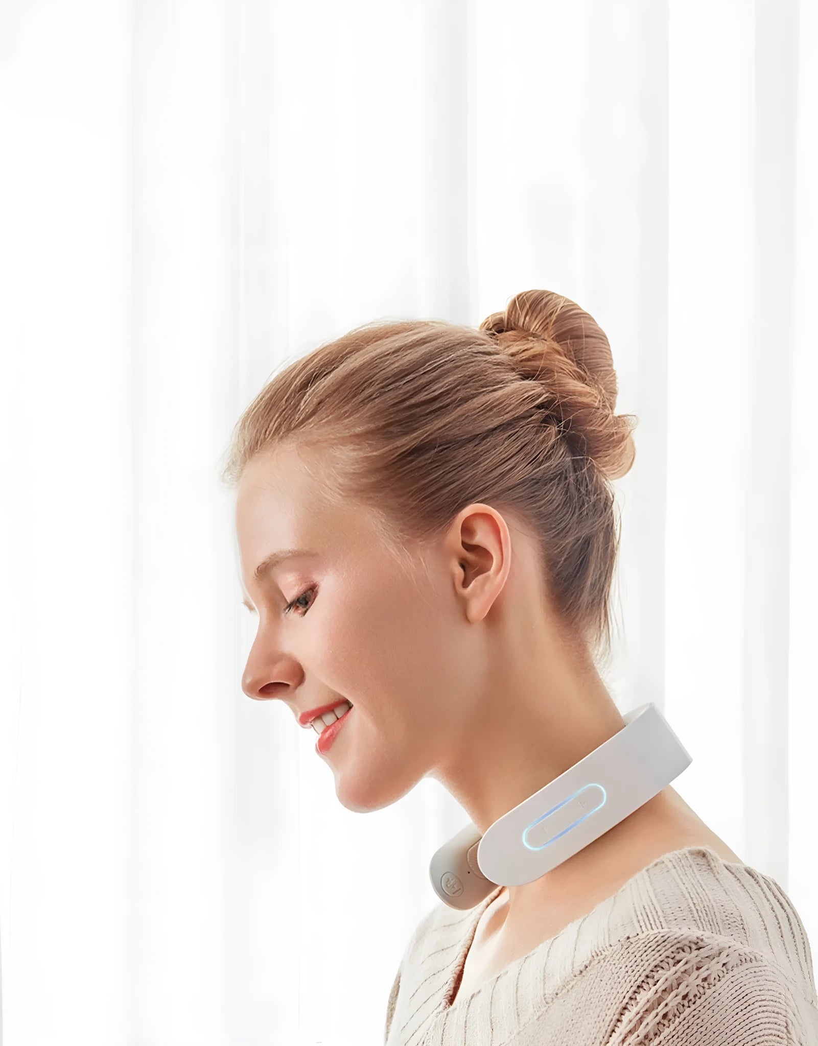 White electric acupressure massager with heat function for back, neck and shoulder pain relief.
