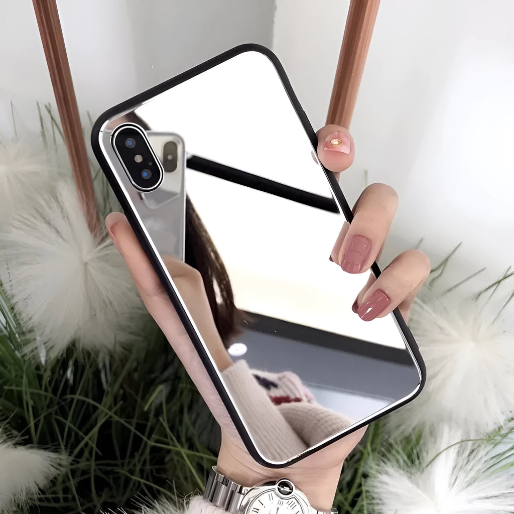 Black mirror iPhone back cover case for iPhone 7 Plus, 8 Plus, and X models on a table.
