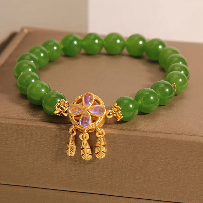 Green jasper bracelet for women with a crystal four-leaf clover dream catcher pendant.