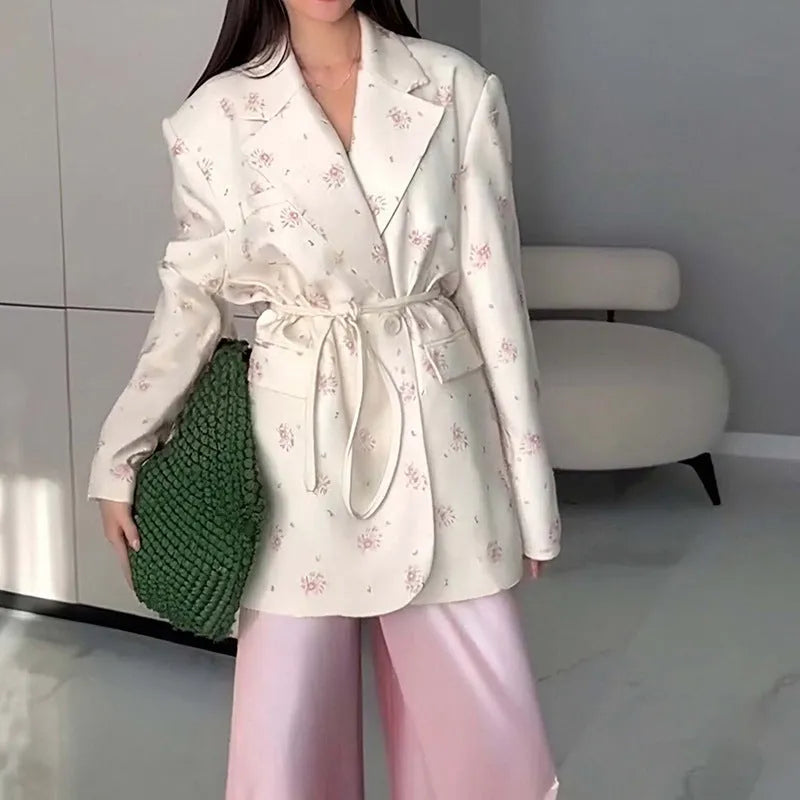 Women's suit jacket with lace-up waist detail in polyester fabric, shown in apricot colour