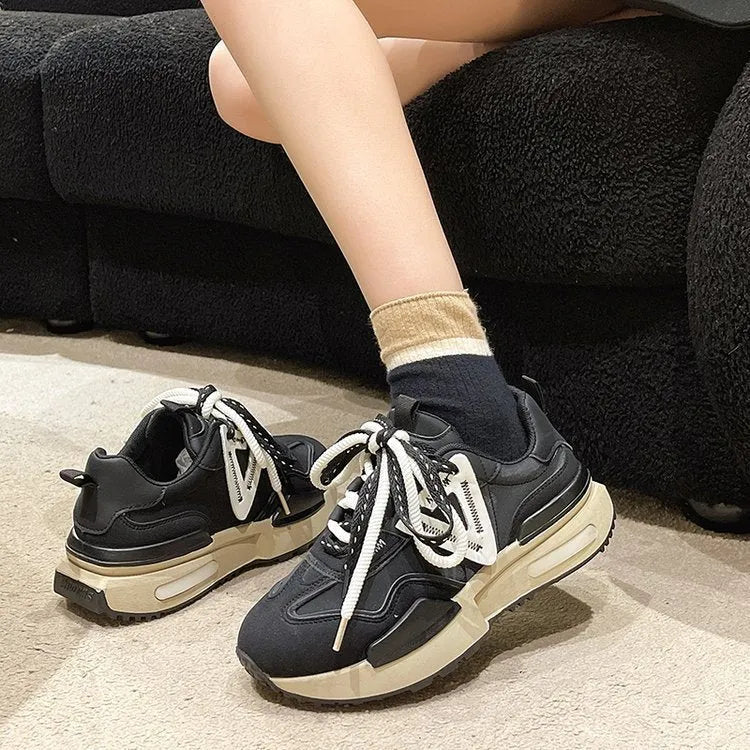 Women's black retro platform sports shoes with round toe and front lace-up closure.