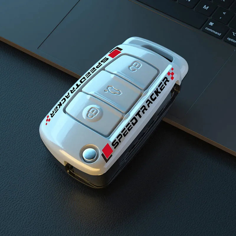 White and carbon coloured car key holders with a carbon fibre texture and mirror surface.