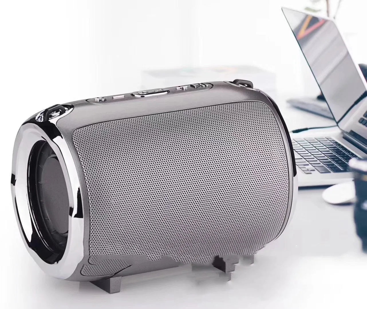 Portable plug-in subwoofer sound system in a metal shell showing button controls and available in five colours.