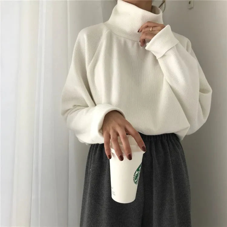 Women's loose-fit long-sleeve top with half-high collar in solid colour options