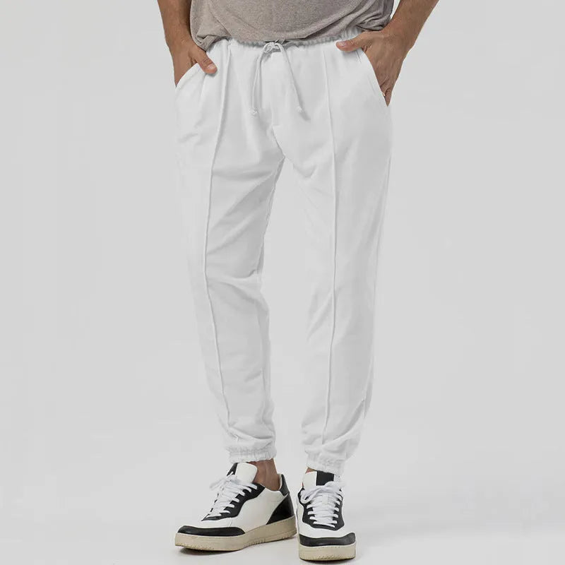 Men's gray elastic track sweatpants with straight-leg tapered design and mid waist