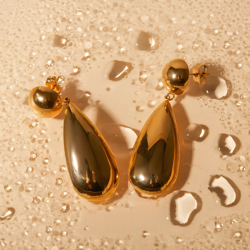 Gold stainless steel water drop pendant earrings with geometric hemisphere design