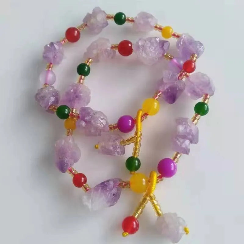 Women's natural amethyst shaped bead bracelet with a fu character charm.