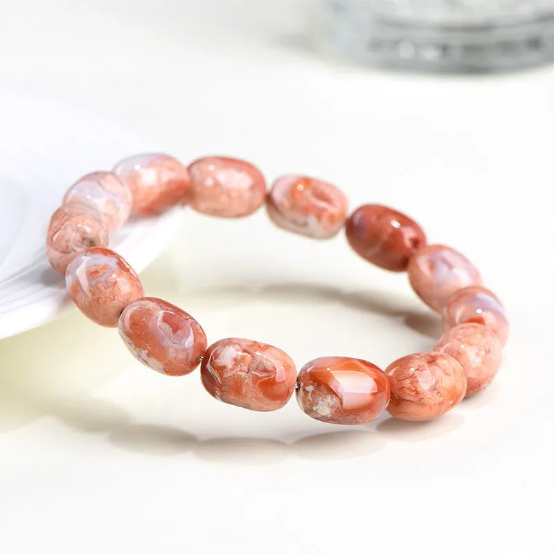Natural cherry blossom agate barrel bead bracelet with 10mm by 14mm geometry design and ruyi element