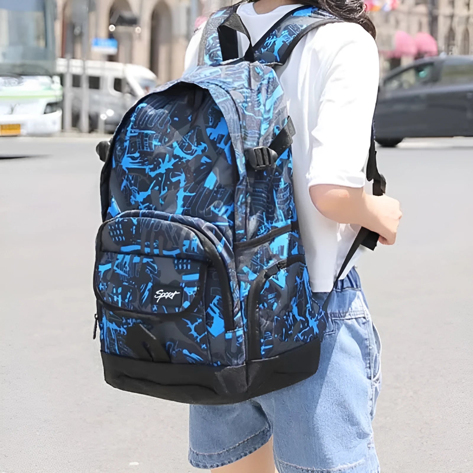 Blue and red classic nylon backpack with large capacity for school, travel, and outdoor use.