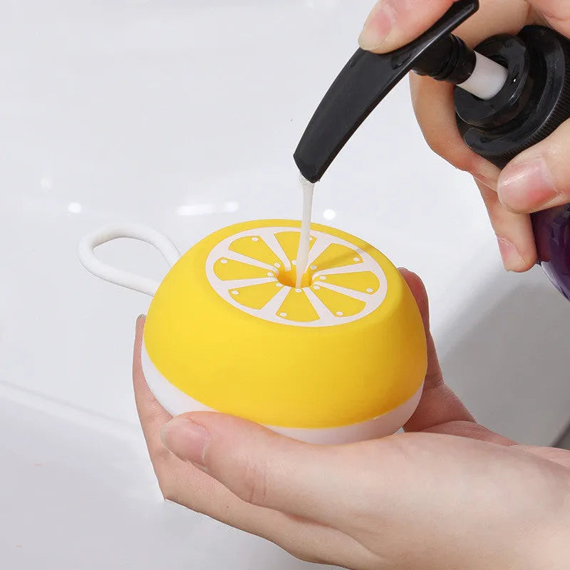 Yellow silicone pet bath brush with massage head for dog and cat grooming during bathing